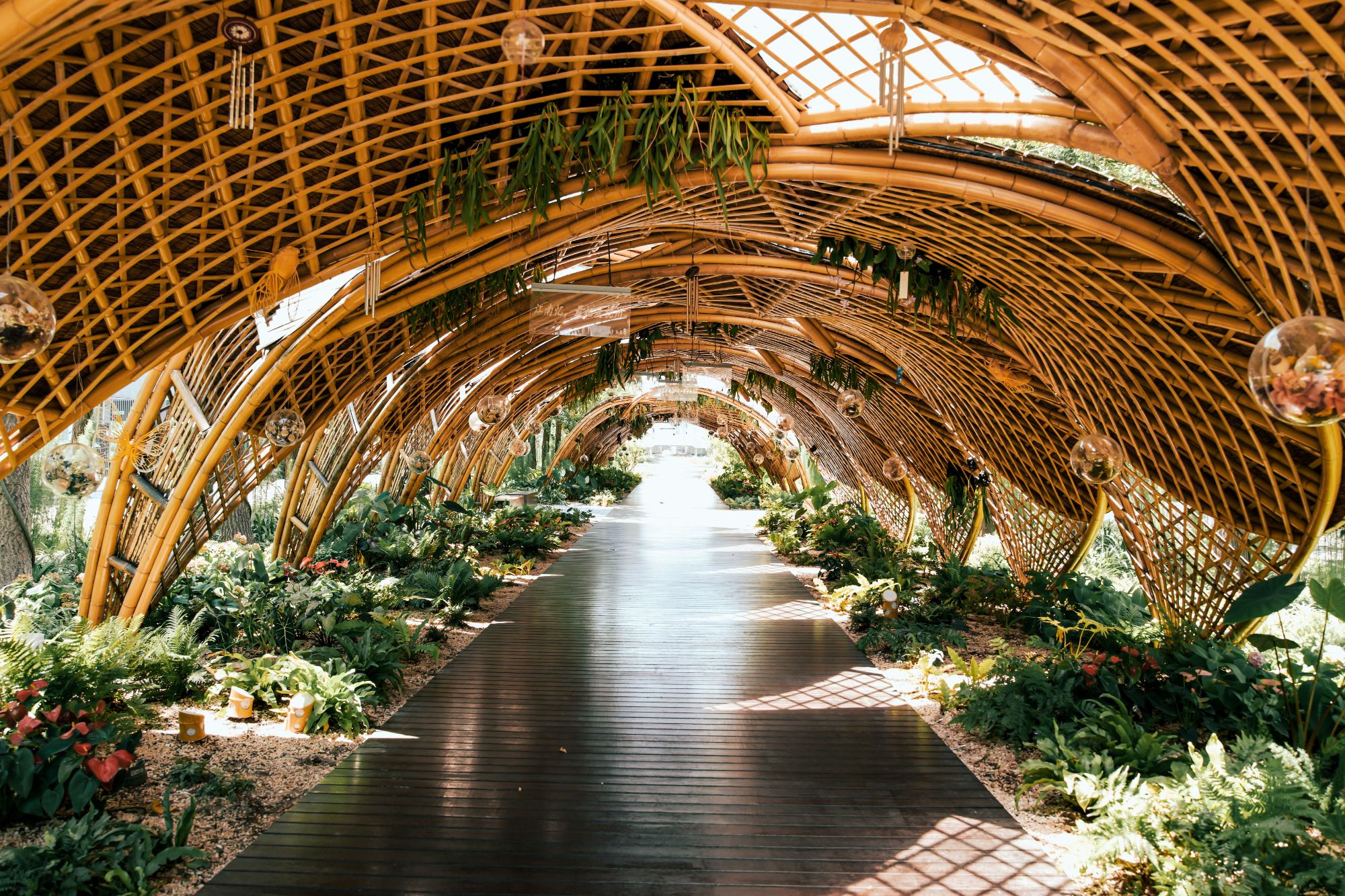 Woven bamboo archway forming a covered garden walkway