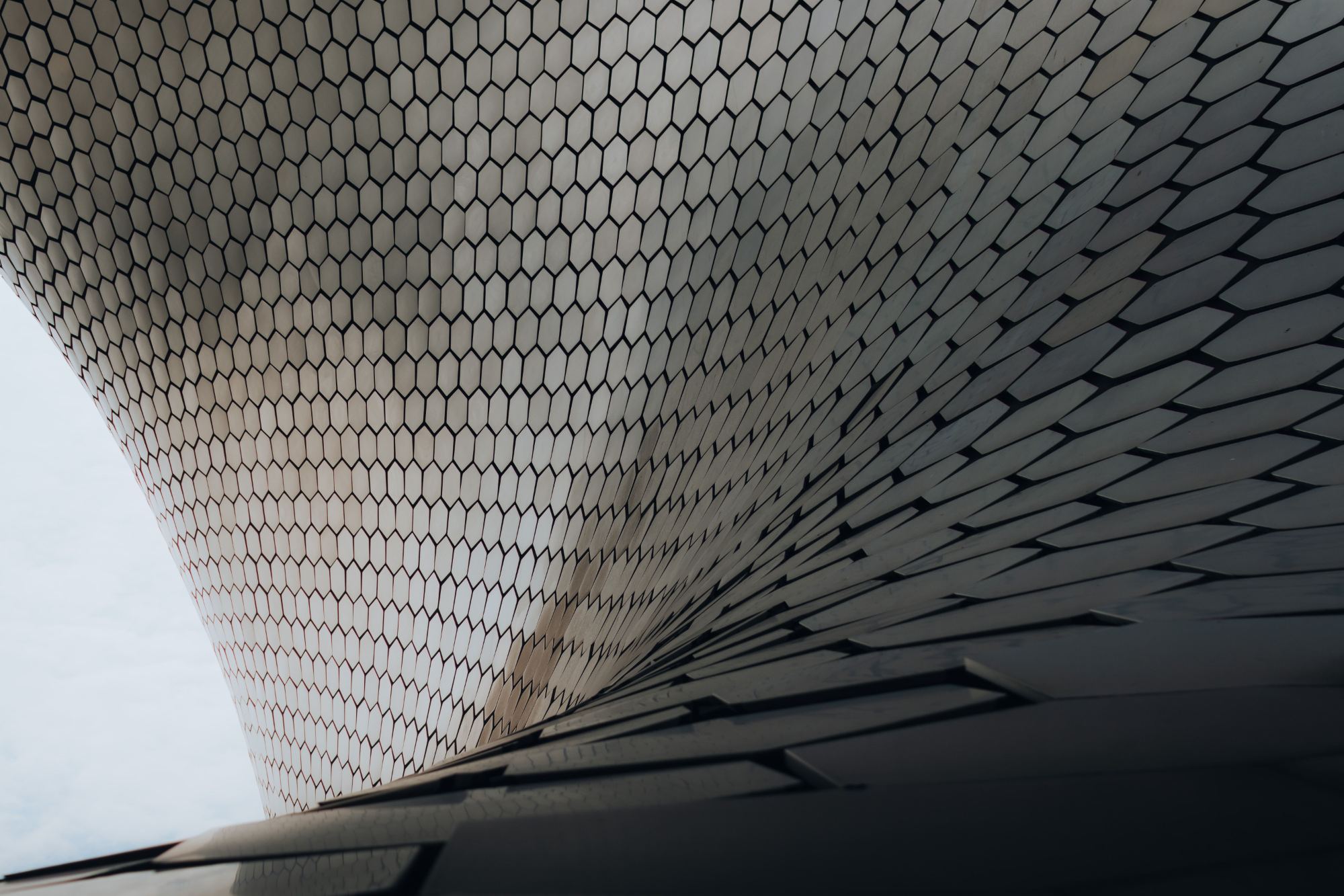 Building facade clad in hexagonal ceramic tiles